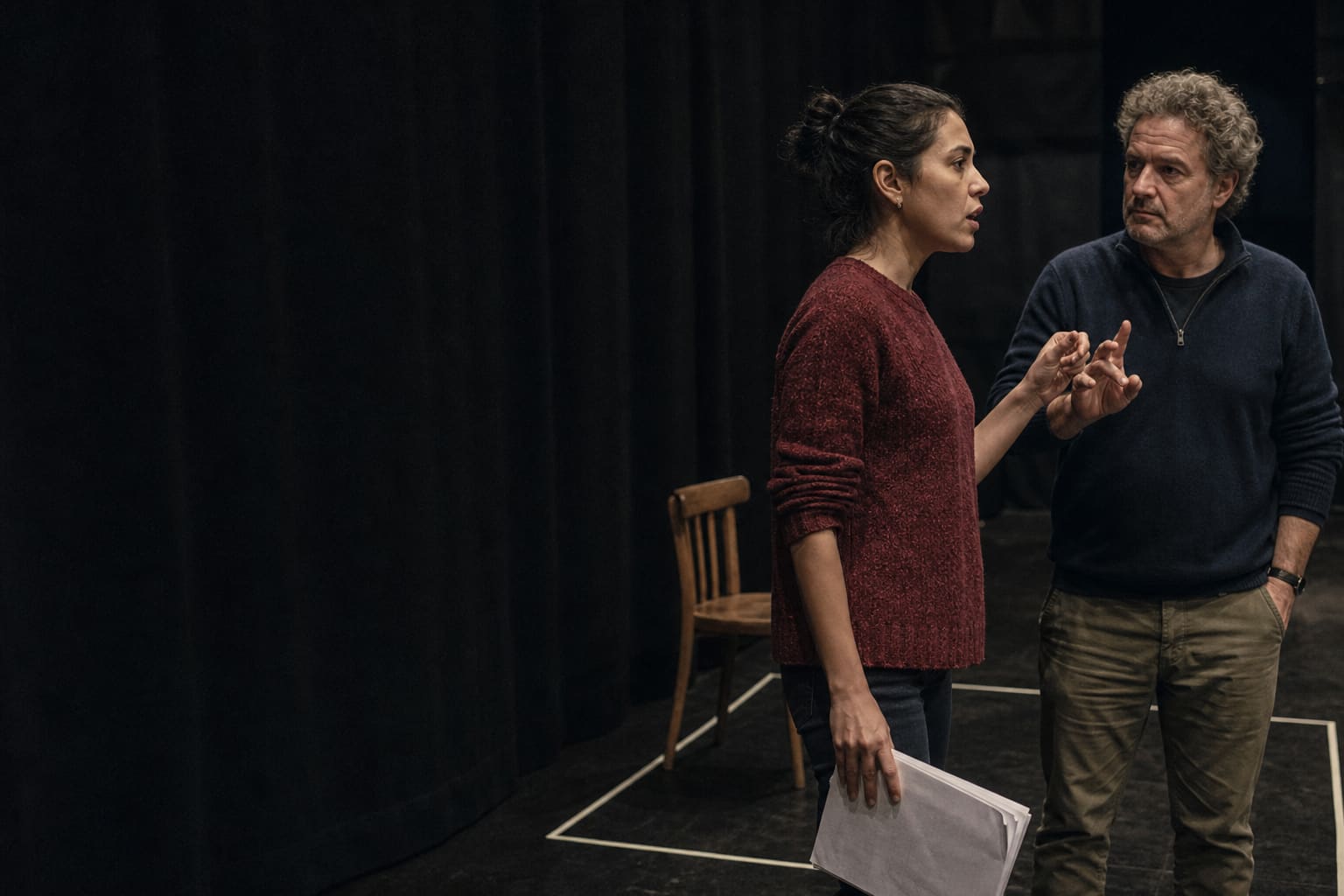 Advanced Spanish learner refining spoken delivery with a theater director