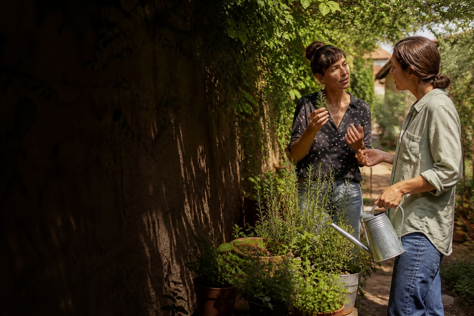 Neighbors practicing conversational Spanish while tending a shared herb garden